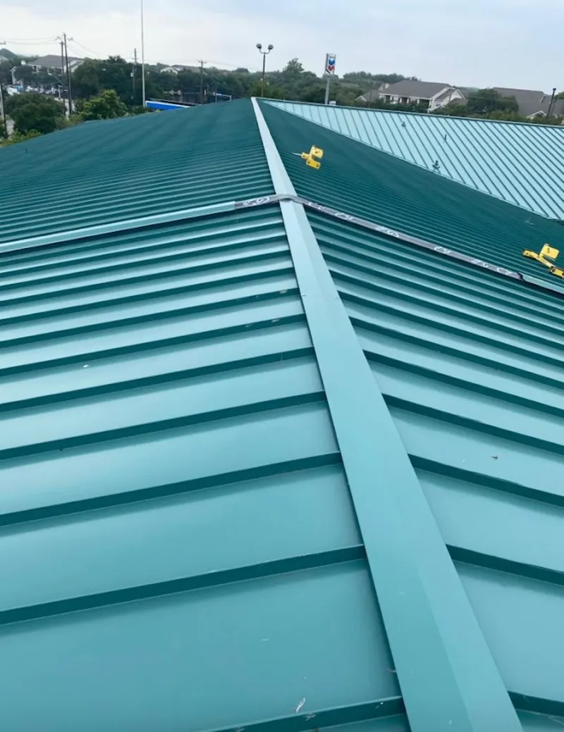 Green commercial metal roof ridge and valley for Metal Roof Repair in Goffstown